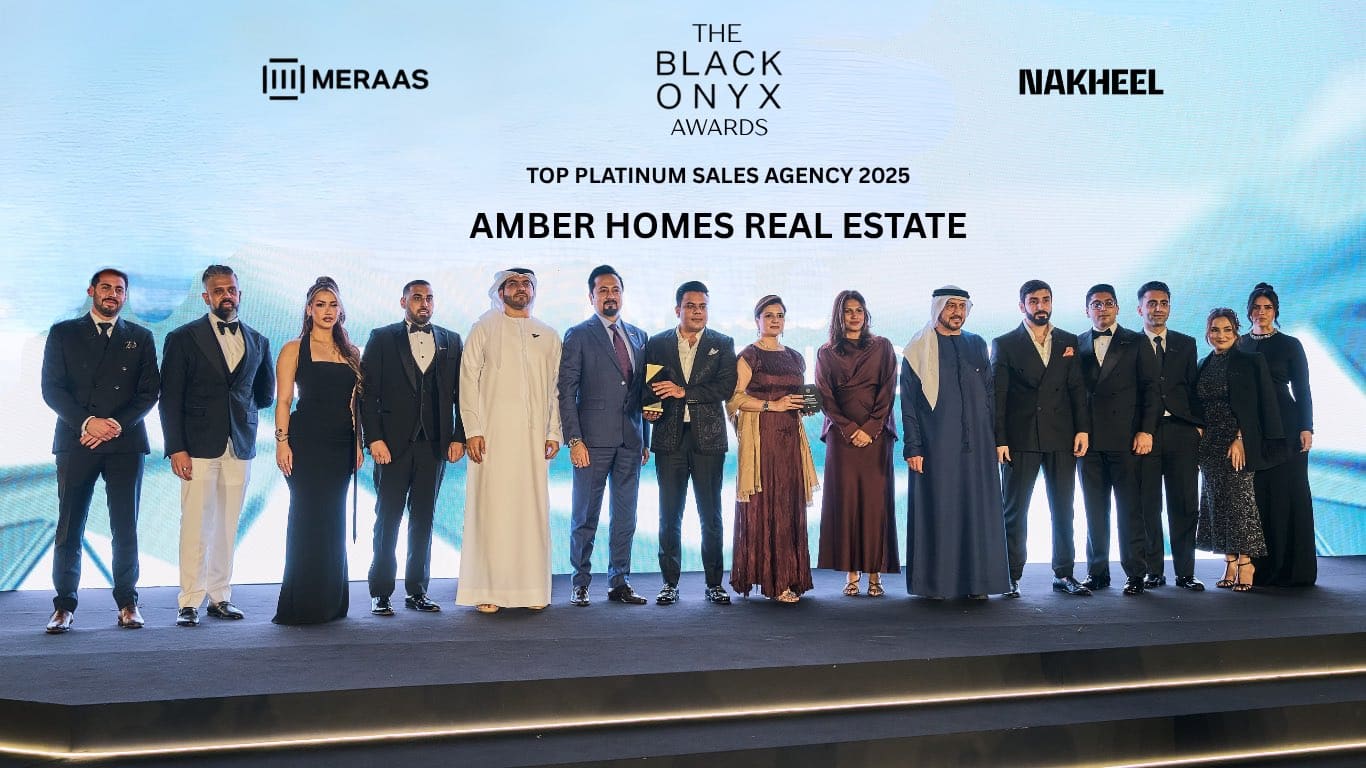 Amber Homes Real Estate team receiving Platinum Sales Agency recognition in Dubai