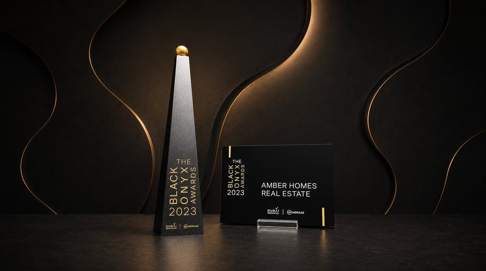 Amber Homes Real Estate — Top Platinum Sales Agency 2023, awarded by Meraas, Nakheel & Dubai Holding (award trophy and certificate)