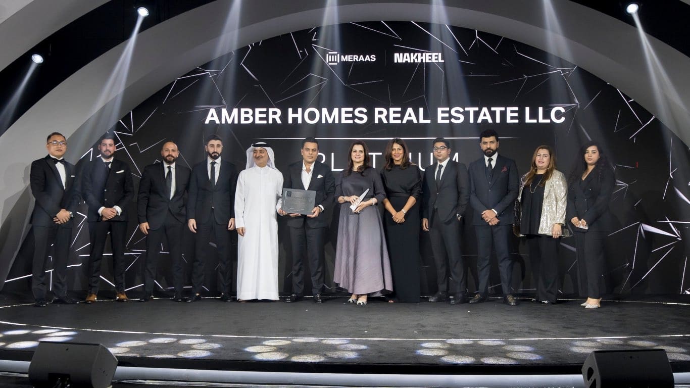 Amber Homes Real Estate team receiving Platinum Agency 2024 from Meraas, Nakheel & Dubai Holding